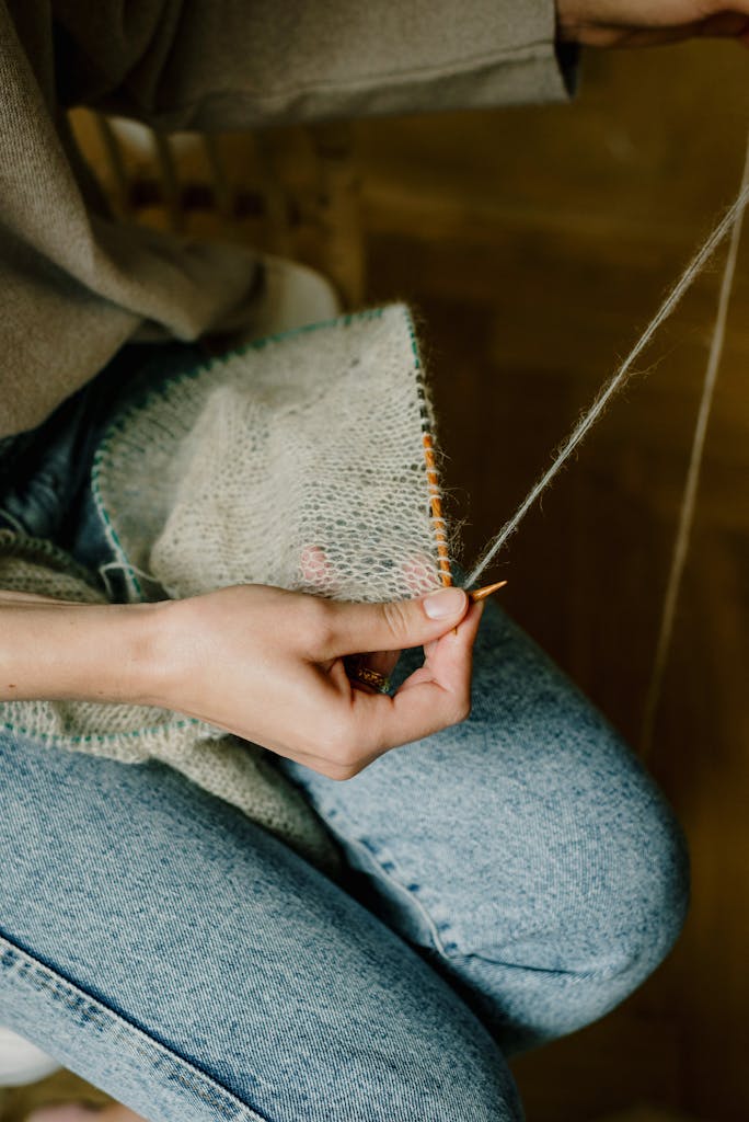Person Knitting using Wood Needles